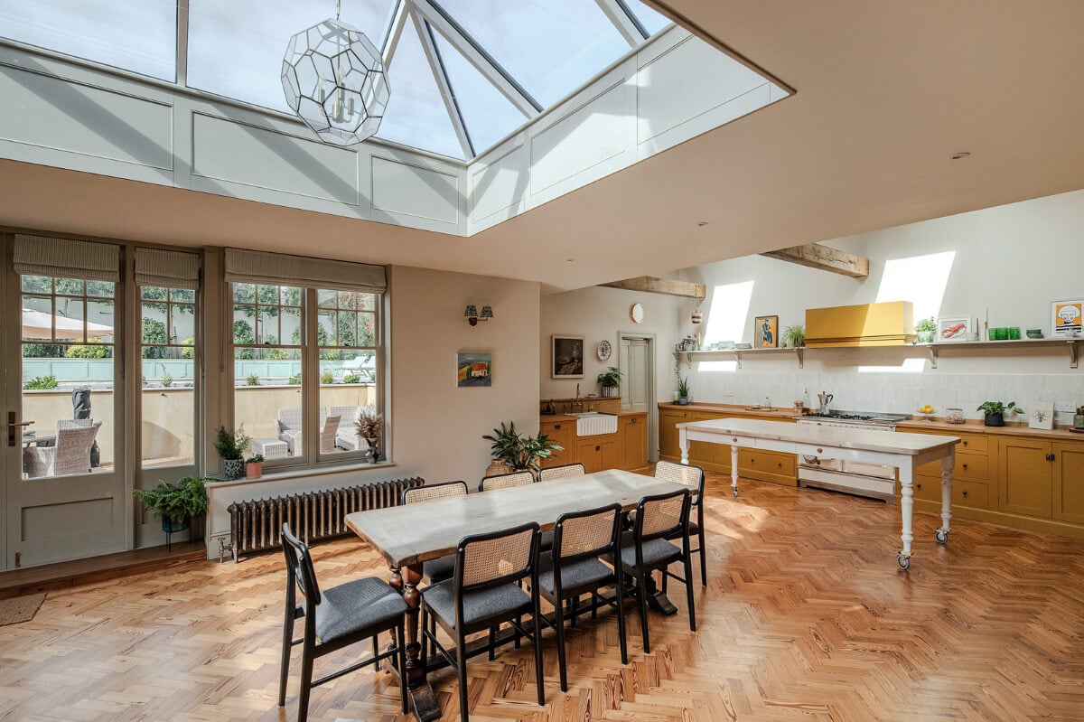 A Grand Edwardian Villa with a Yellow Kitchen and Coastal Views 6 grand open plan kitchen space large skylight