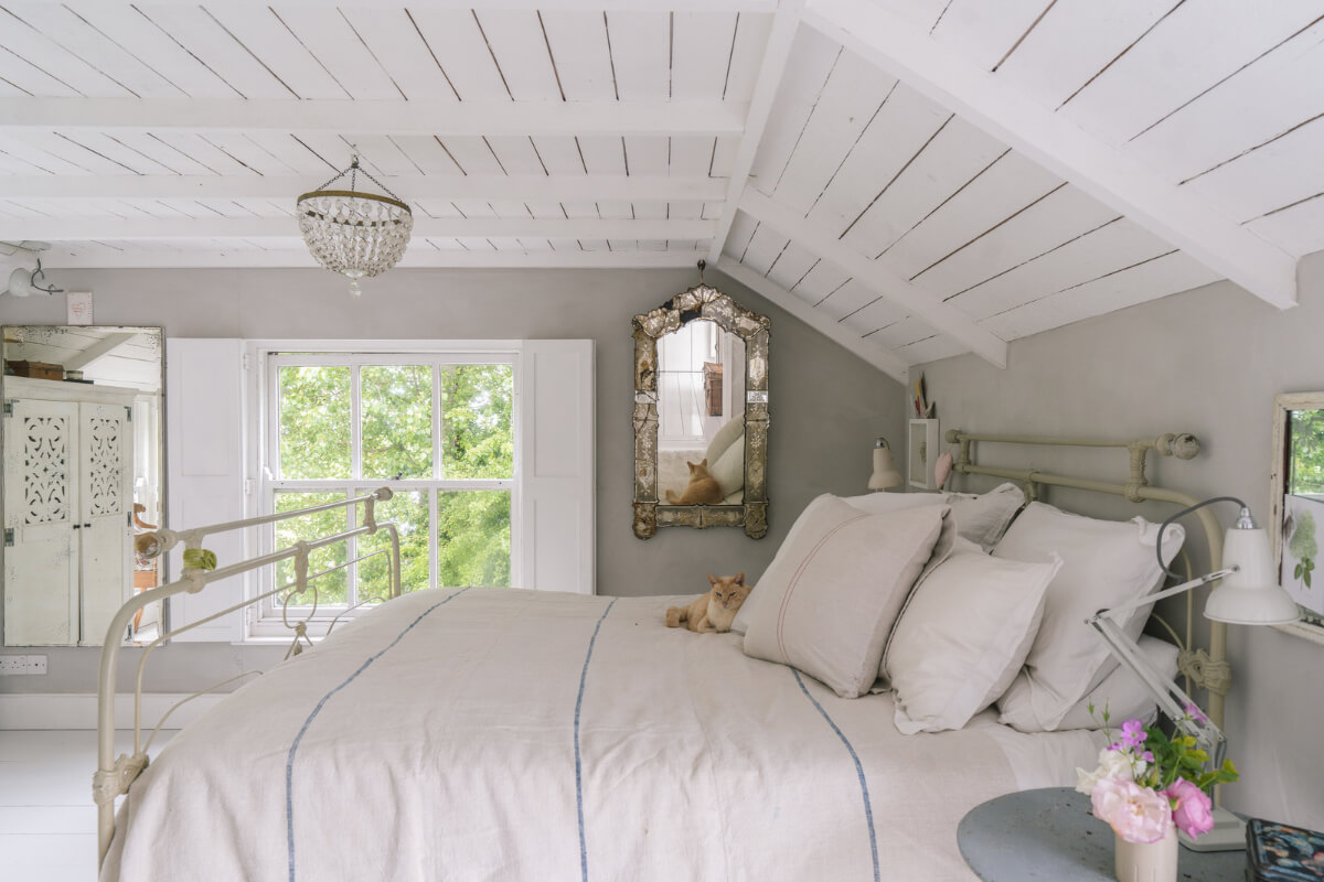 A Bright New England-Style Home with a Lush Garden 10 gray and white bedroom timber ceiling