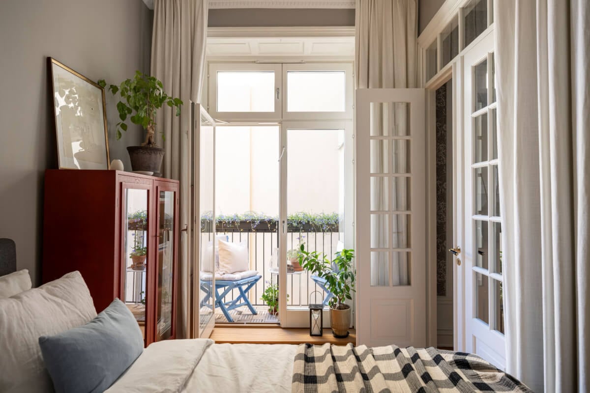 Wallpapers and Blue Tones in a Cozy Turn-of-the-Century Home 19 gray bedroom with balcony