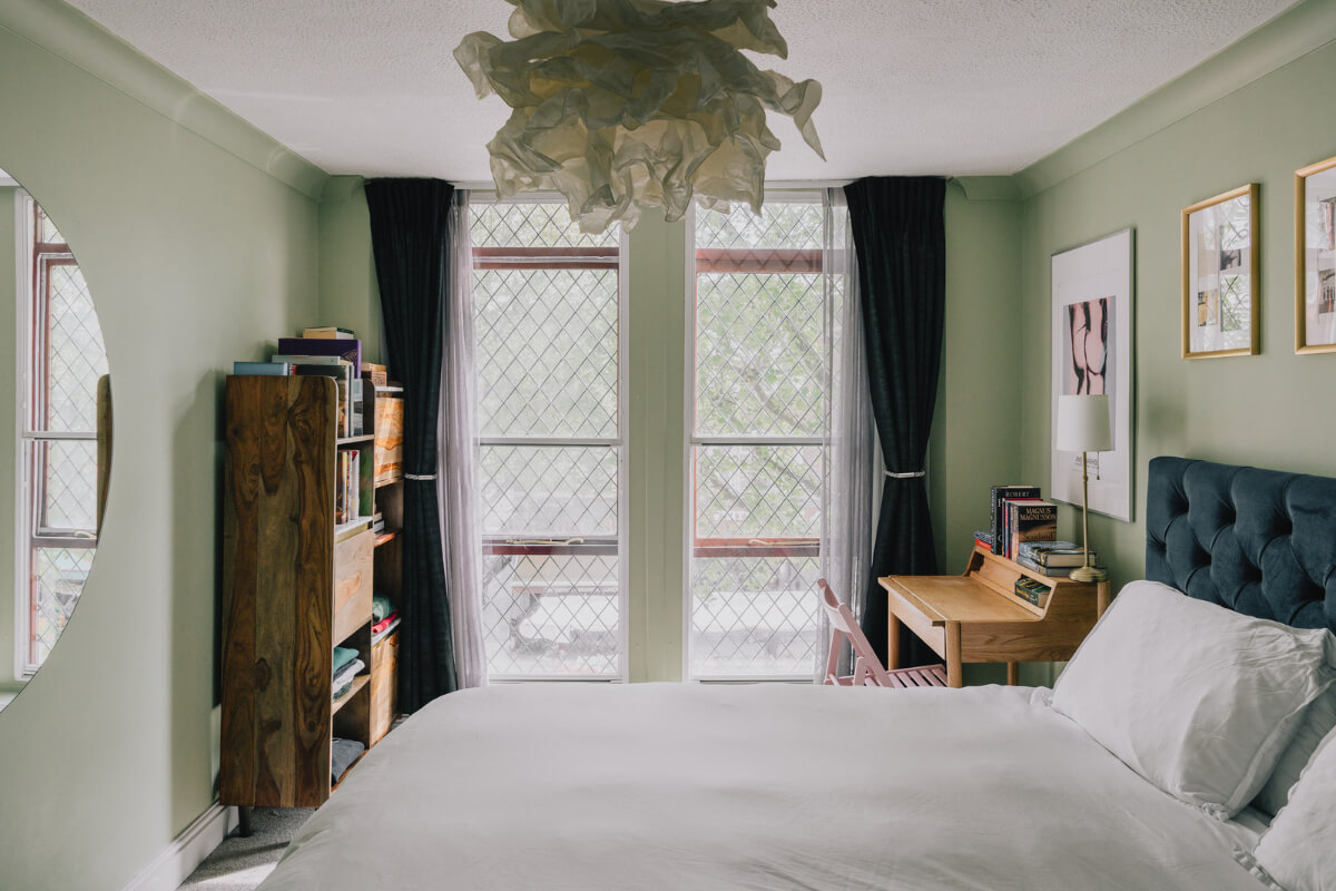 A Colorful Apartment in a Former Victorian Church in London 9 green bedroom with desk