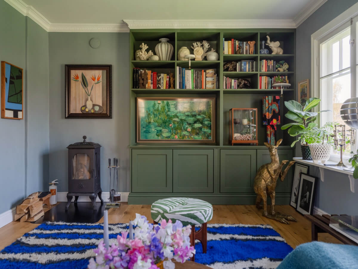 An Early 20th-Century Family Home Decorated with Color and Art 4 green built-in bookcases living room