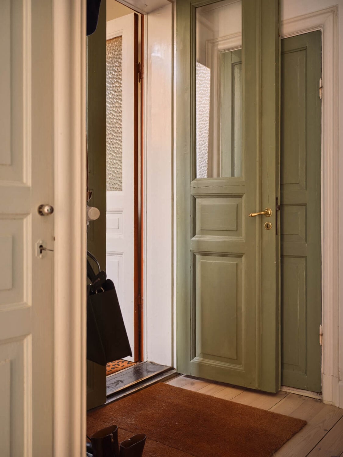 A Cozy, Tiny Apartment with a Golden Yellow Bedroom 19 green front door
