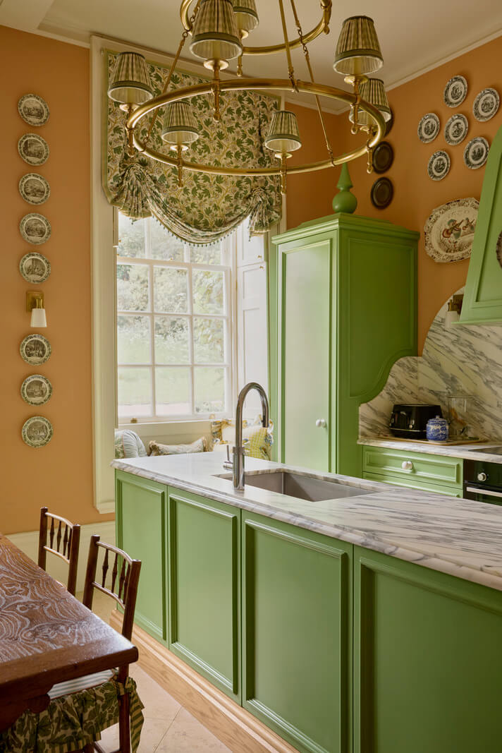 Trend Alert: The 'Soft Kitchen' is 2026's Coziest Interior Trend and It's Here to Stay 14 green kitchen cabinets marble countertop backsplash