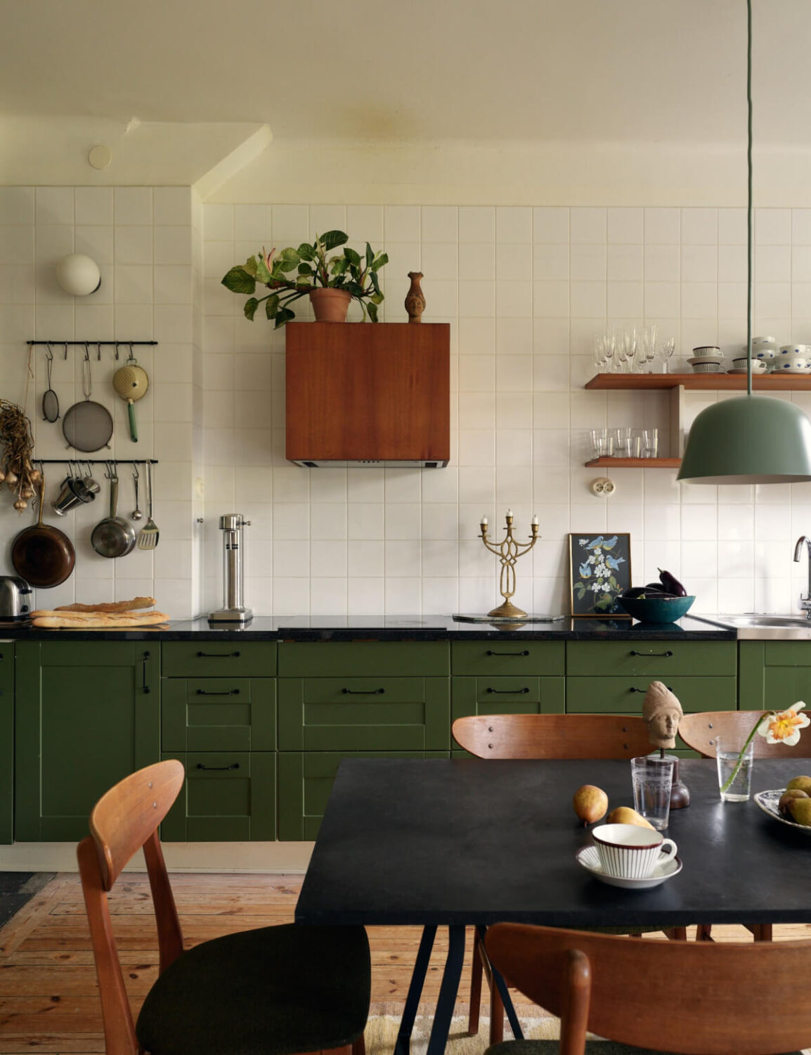 An Art Nouveau Apartment with a Deep Green Kitchen 5 green kitchen white tiles