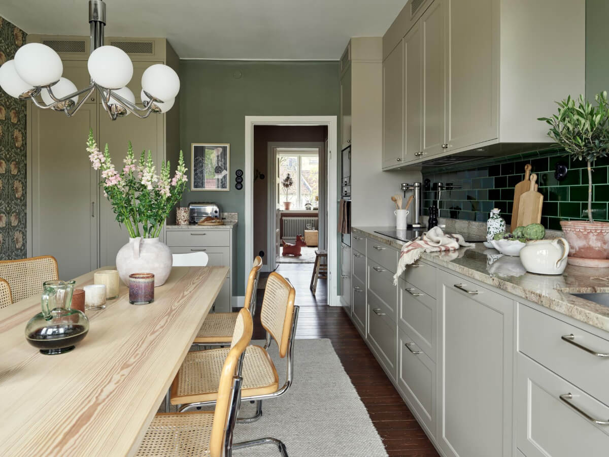 A Harmonious Color Palette in a Swedish Duplex Apartment 6 green kitchen william morris wallpaper