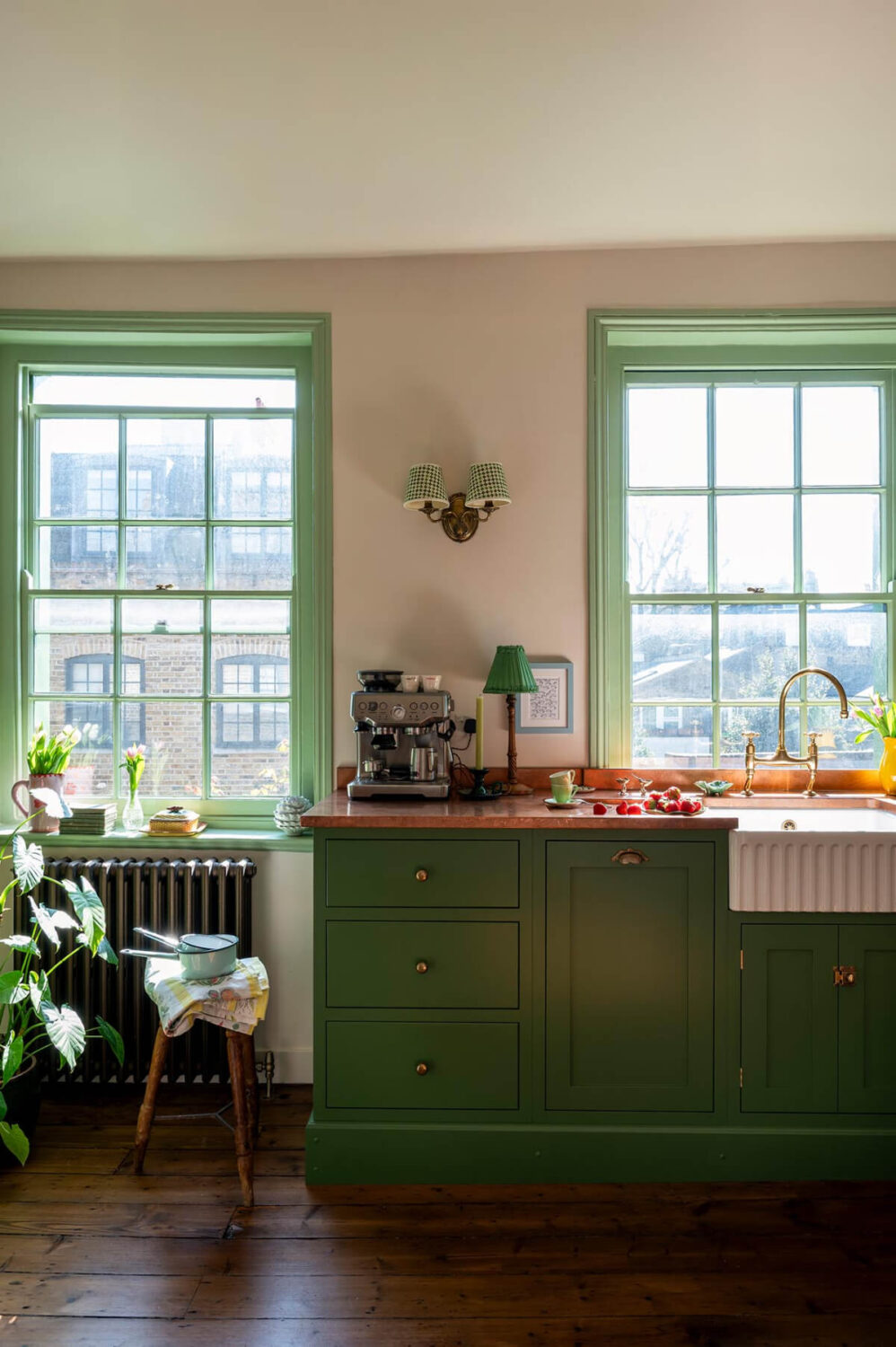 A Small, Green deVOL Kitchen in a 17th-Century London Mews House 6 green shaker cabinets large green sash windows mews house nordroom