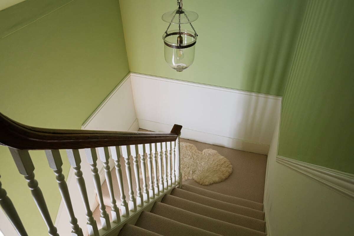 A Family Home with a Cheerful Color Palette in a Historic House 24 green staircase
