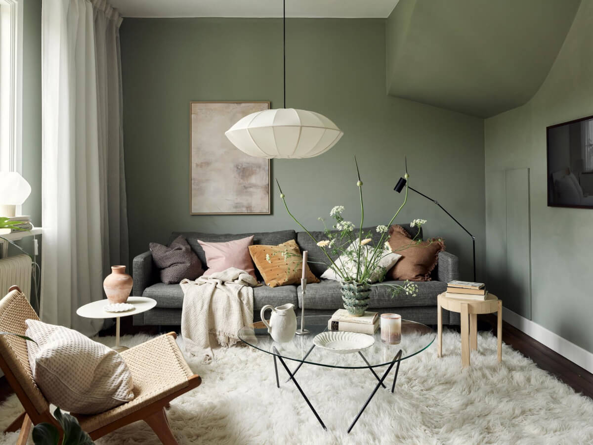 A Harmonious Color Palette in a Swedish Duplex Apartment 11 green walls living room