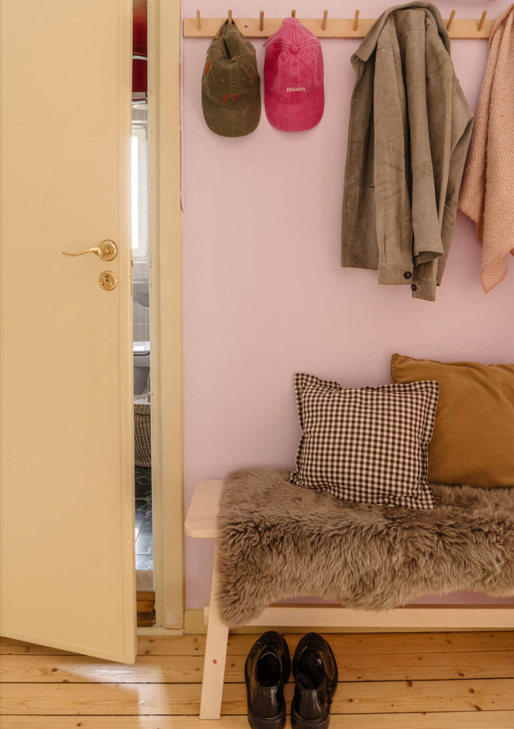 A Stylish and Joyful Color and Material Palette in a Midcentury Apartment 23 hall lilac walls yellow door