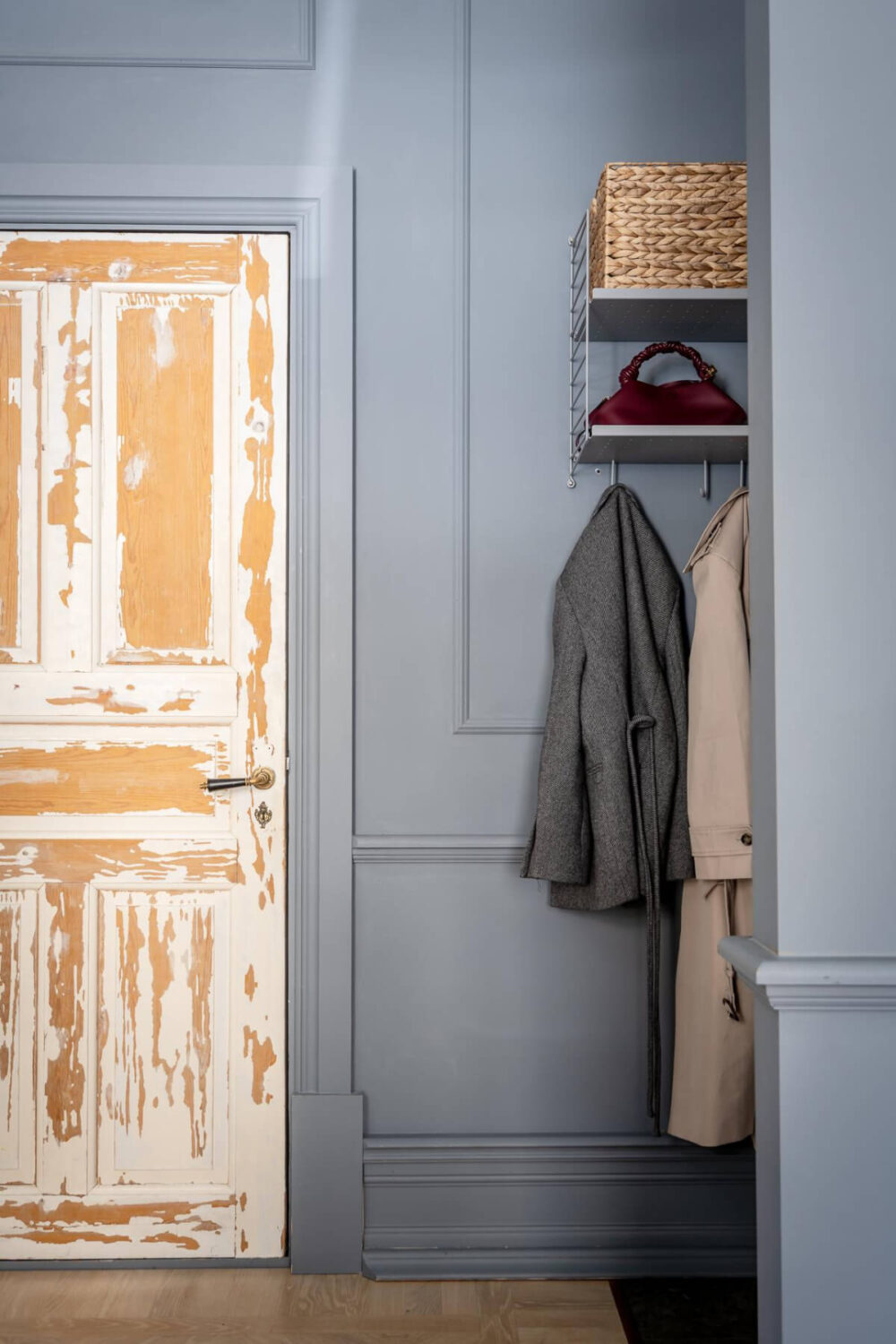 A Blue Studio Apartment with Unique Stucco and Site-Built Storage 15 hall raw wooden door