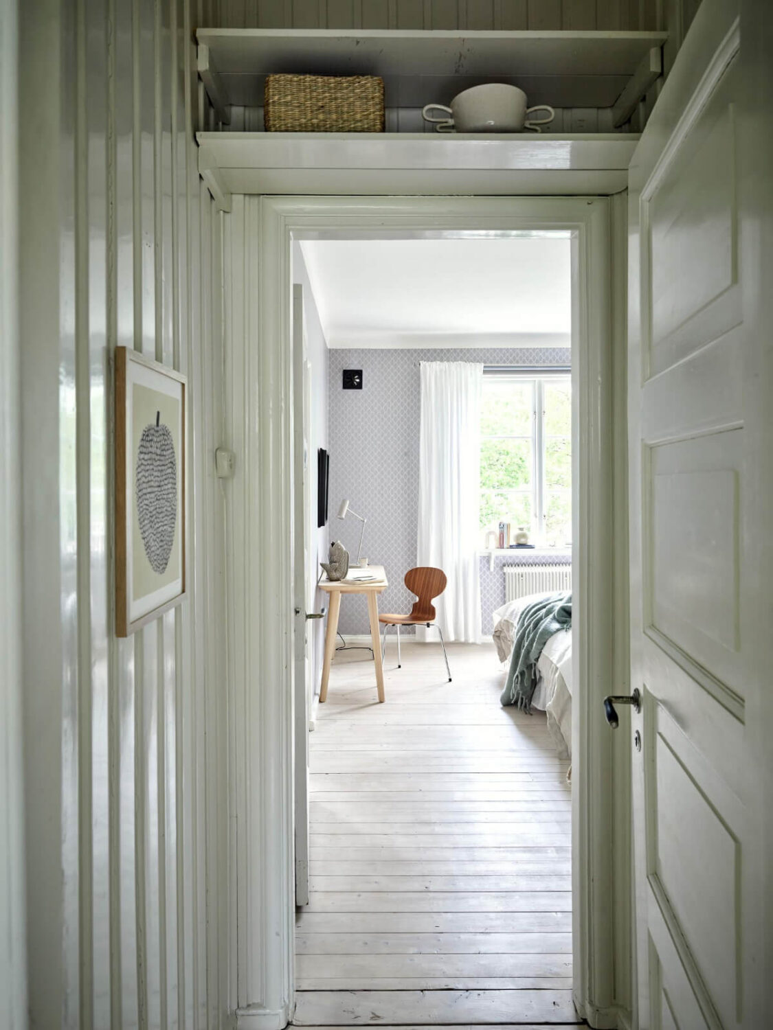 An Apartment with Original Details and a Stunning Period-Style Bathroom 22 hall shelves above doorframe
