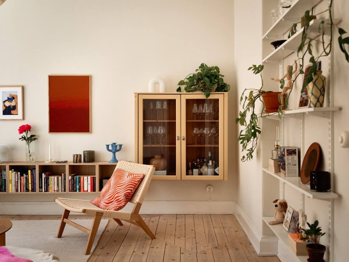 A Light-Filled Stockholm Apartment with Bright Color Pops 8 hanging class cabinet
