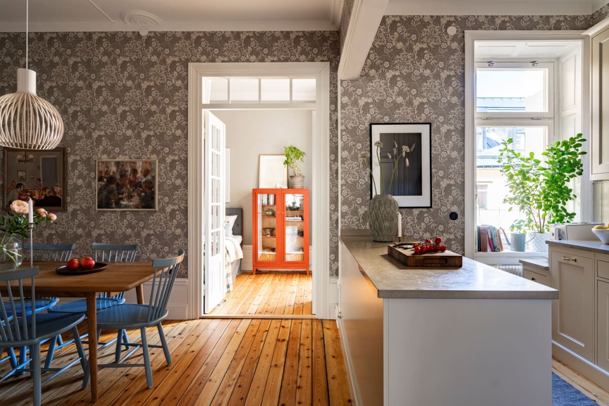 Wallpapers and Blue Tones in a Cozy Turn-of-the-Century Home 8 kitchen and dining room wooden floor floral wallpaper