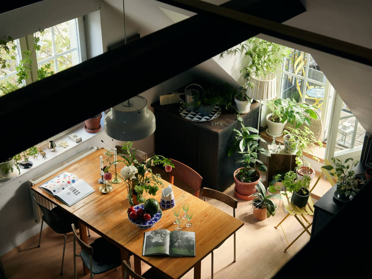 A Stunning Top-Floor Apartment with High Ceilings in a Former Church 3 kitchen dining table plants