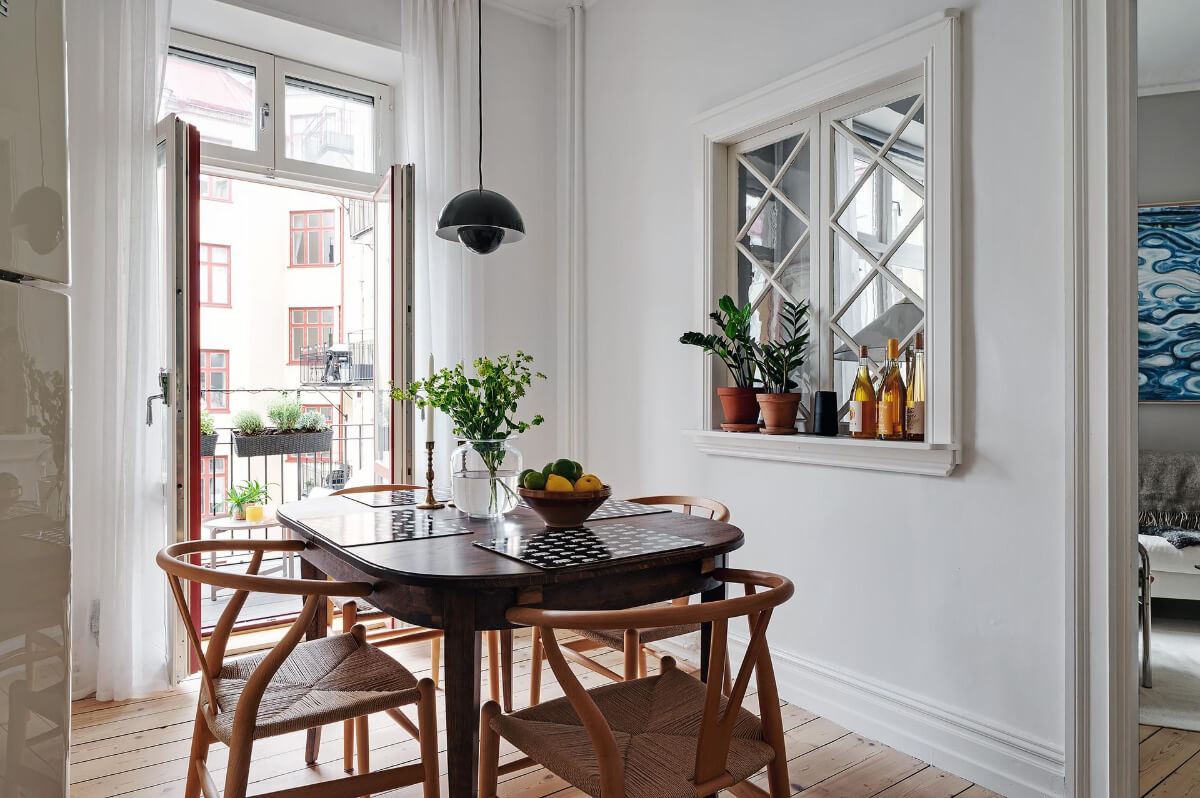 Classic Elements in a Charming Swedish Studio Apartment 19 kitchen dining table