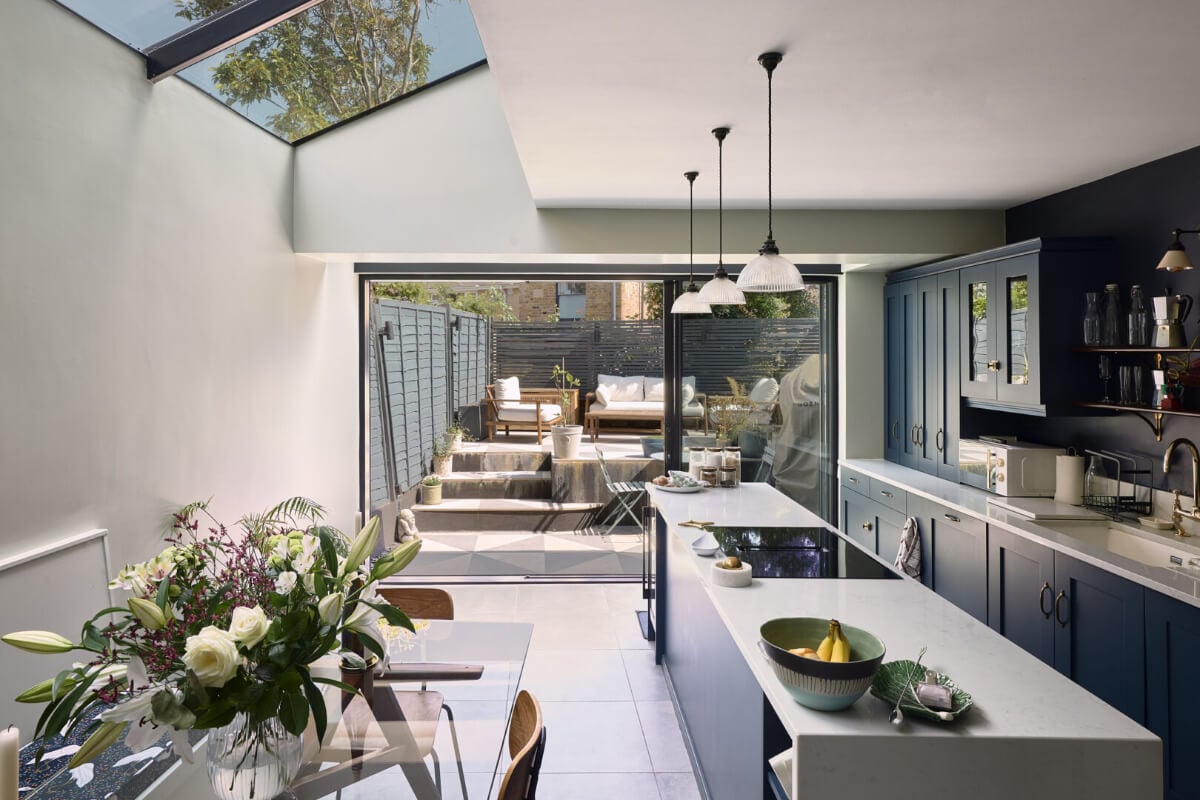 Moody Tones in a Restored and Extended Victorian Home in London 4 kitchen extension skylight large garden doors
