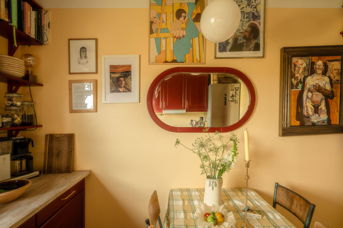 A Stylish and Joyful Color and Material Palette in a Midcentury Apartment 15 kitchen gallery wall and table