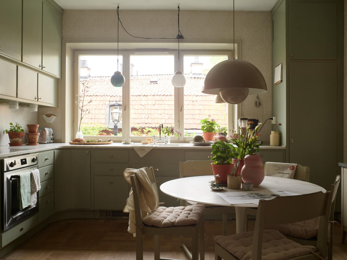 Wallpapers and a Midcentury-Style Kitchen in a 1930s Apartment 9 kitchen green cabinets double row upper cupboards breakfast table