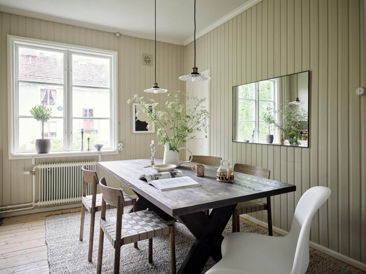 Why Everyone’s Adding Mirrors to Their Kitchens (And You Should Too) 17 kitchen paneled walls large dining table mirror
