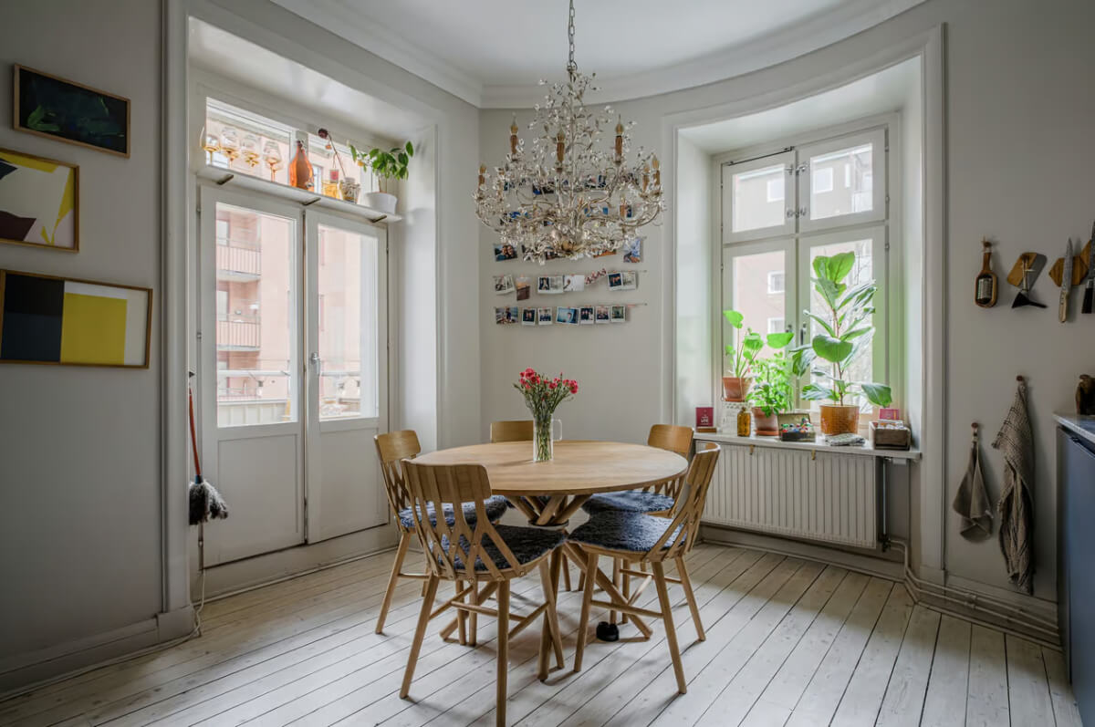 A Spacious One-Bedroom Apartment in Gothenburg 7 kitchen round wooden dining table light floorboards