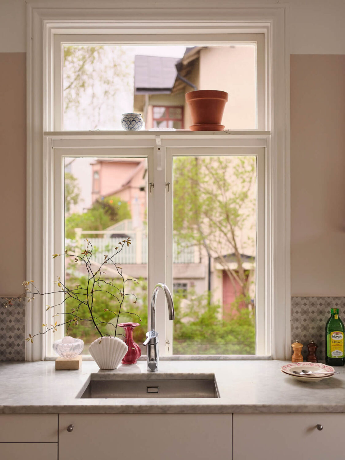 A Light Ground Floor Apartment with a Large Terrace 12 kitchen sink under window with shelf
