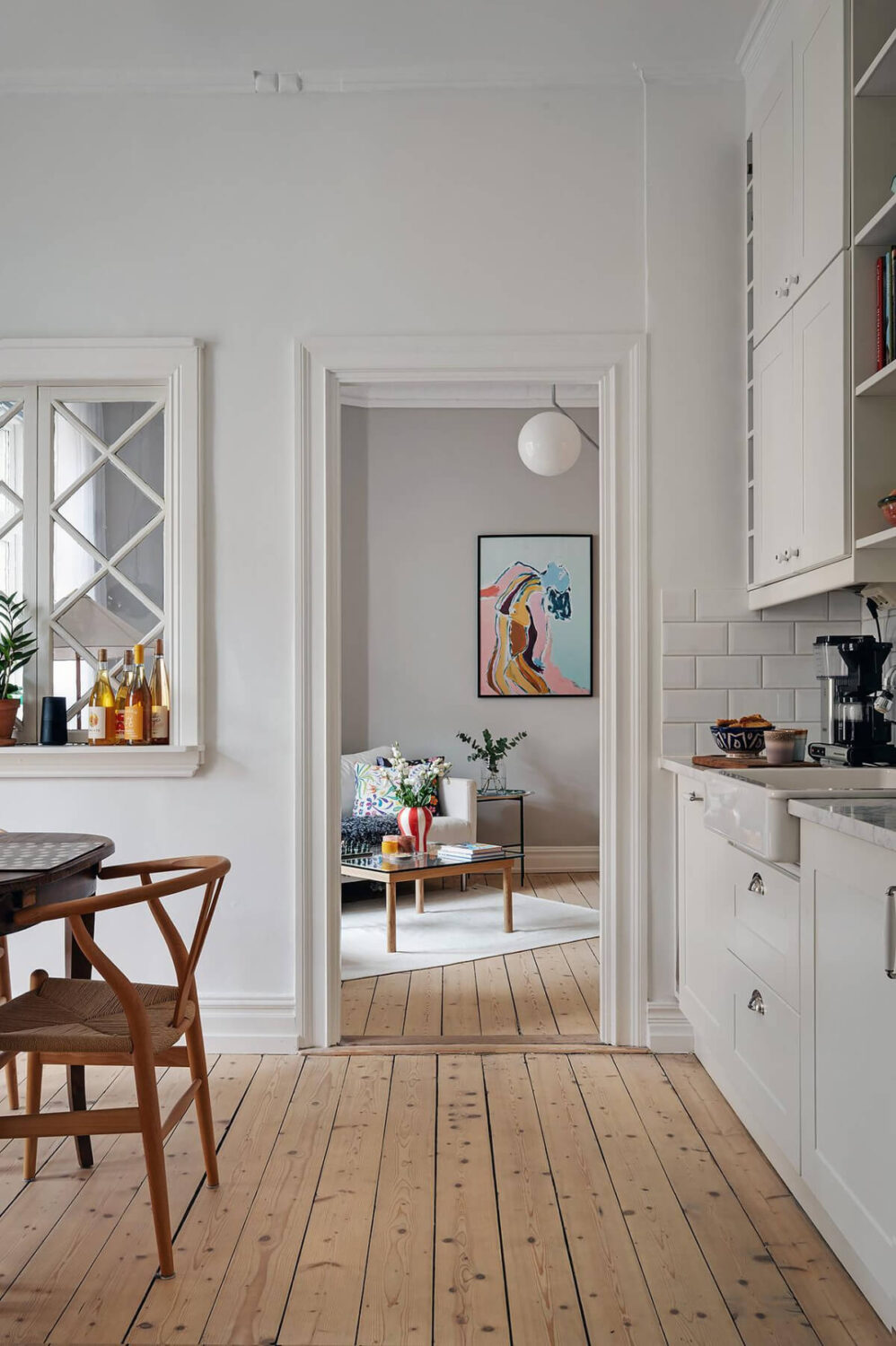 Classic Elements in a Charming Swedish Studio Apartment 16 kitchen view into room