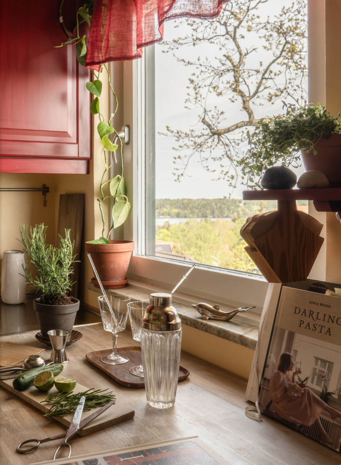 A Stylish and Joyful Color and Material Palette in a Midcentury Apartment 13 kitchen window
