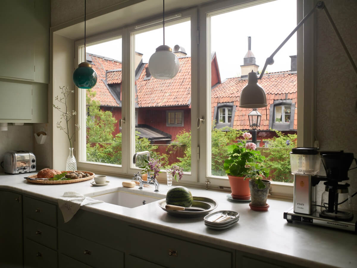 Wallpapers and a Midcentury-Style Kitchen in a 1930s Apartment 10 large kitchen window
