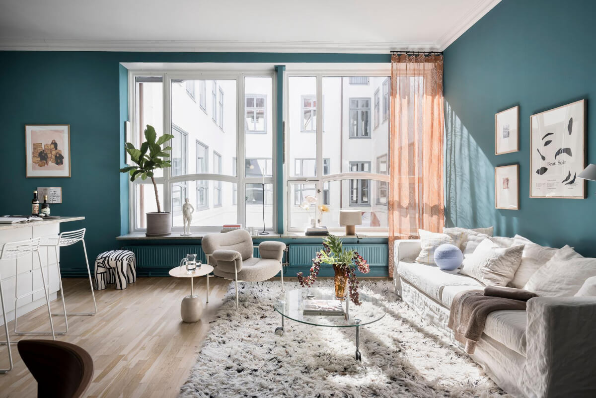 A Teal Green Living Room and Large Windows in a Swedish Apartment 2 large windows teal green walls living roo