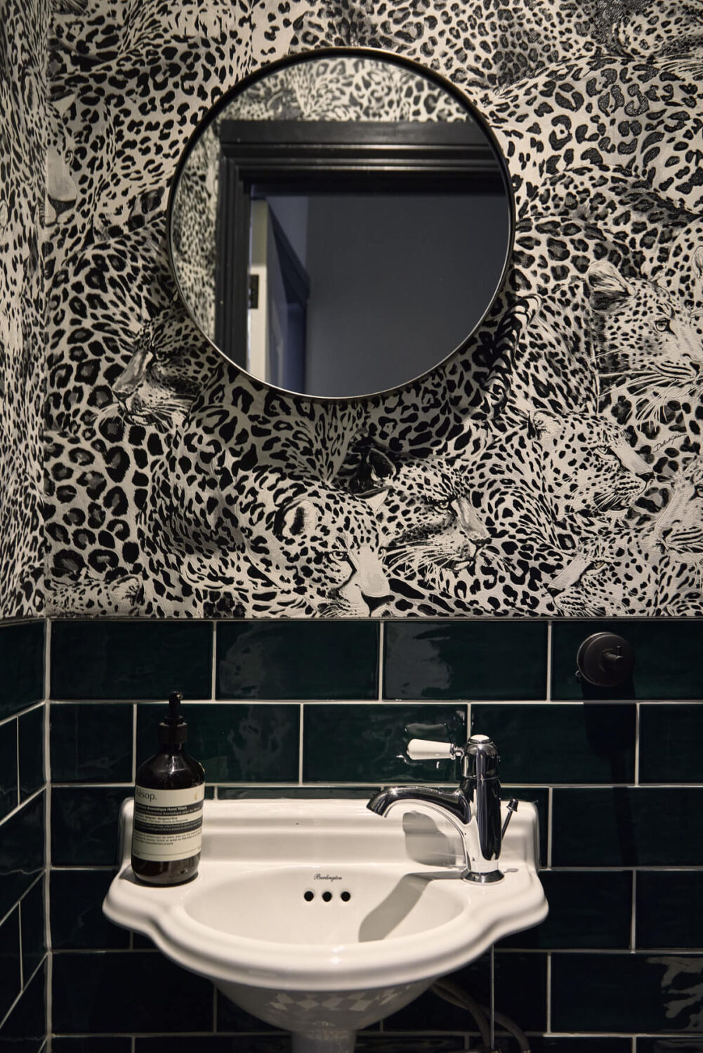 Moody Tones in a Restored and Extended Victorian Home in London 13 leopard wallpaper powder room