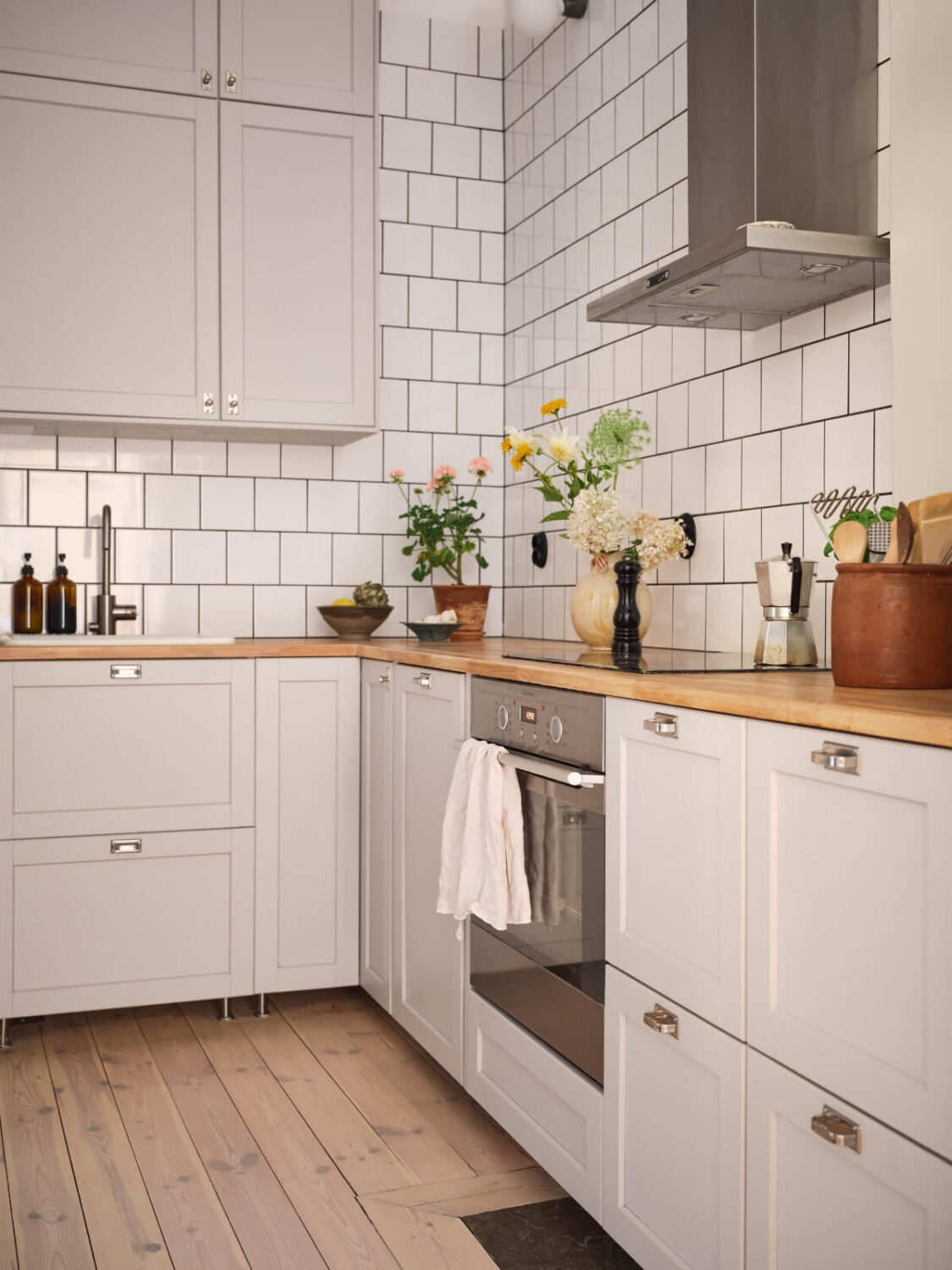 Best of 2025: Kitchens 13 light gray kitchen cabinets white backsplash tiles wooden floro