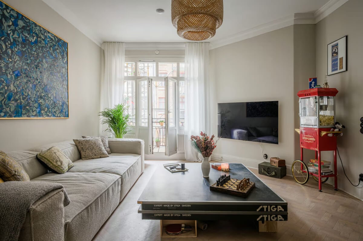 A Spacious One-Bedroom Apartment in Gothenburg 2 light gray walls swedish living room