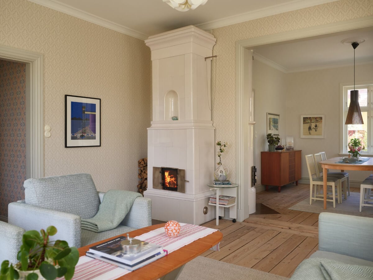 Light-Filled Rooms and Wallpapers in a Swedish Country House 1 light living room wooden floor fireplace