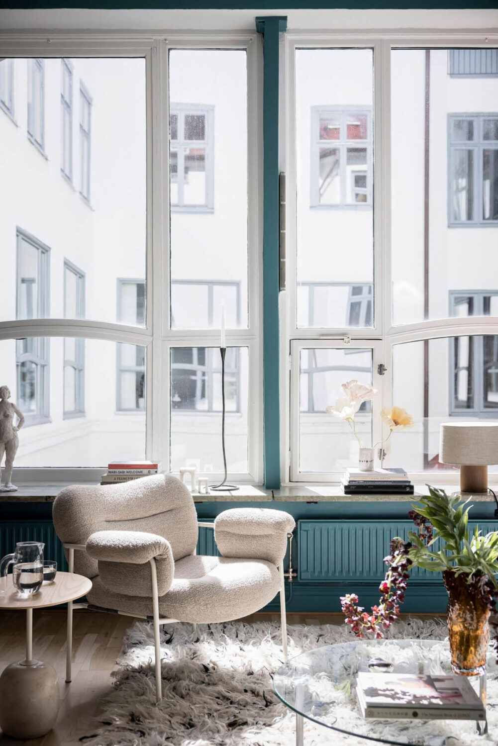 A Teal Green Living Room and Large Windows in a Swedish Apartment 5 living room detail large windows