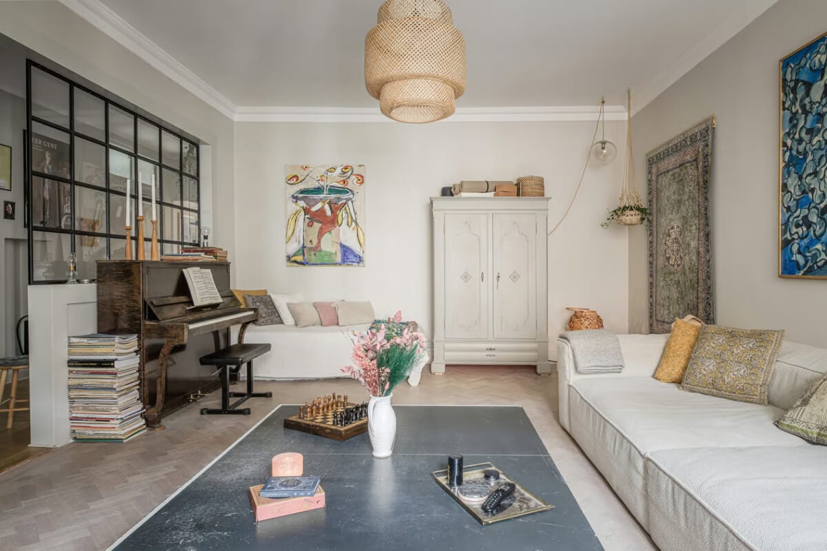 A Spacious One-Bedroom Apartment in Gothenburg 1 living room herringbone floor piano industrial window nordroom