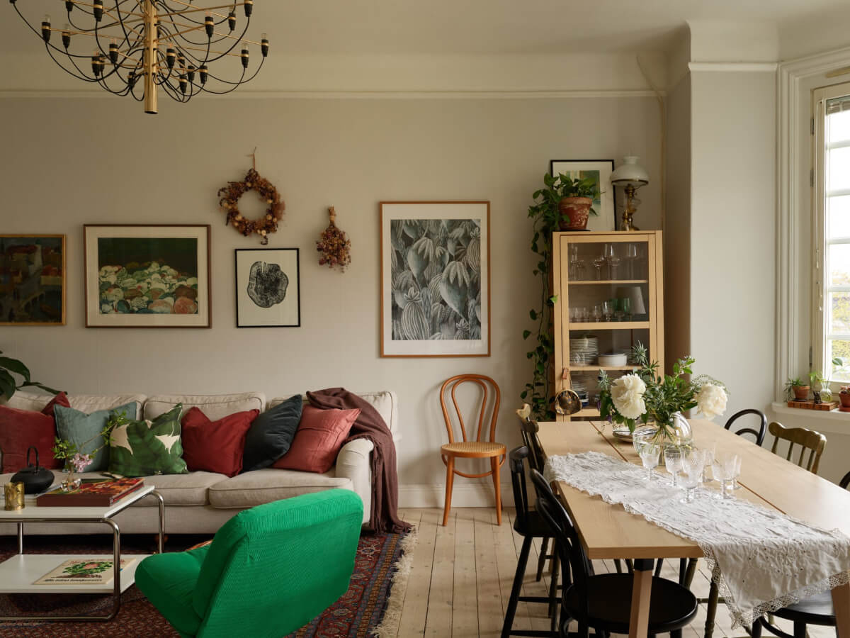 A Beautifully Renovated Early 20th-Century Apartment 2 living room light gray walls wooden floor bay window