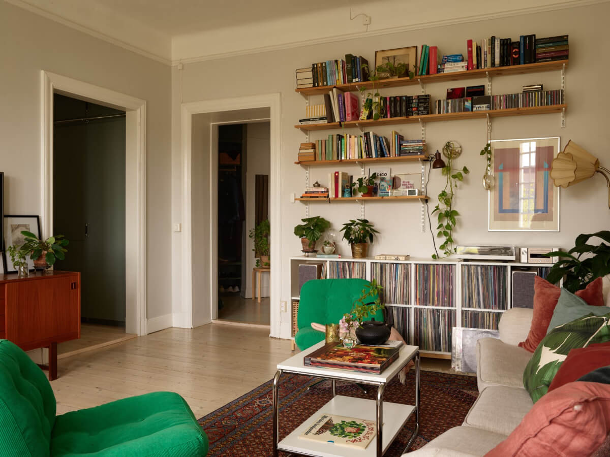 A Beautifully Renovated Early 20th-Century Apartment 10 living room music storage cabinets bookshelves