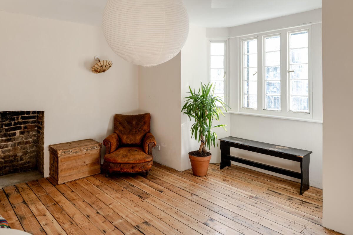 Grand, Light-Filled Spaces in a Gothic-Style English Coastal Home 27 living room wooden floor