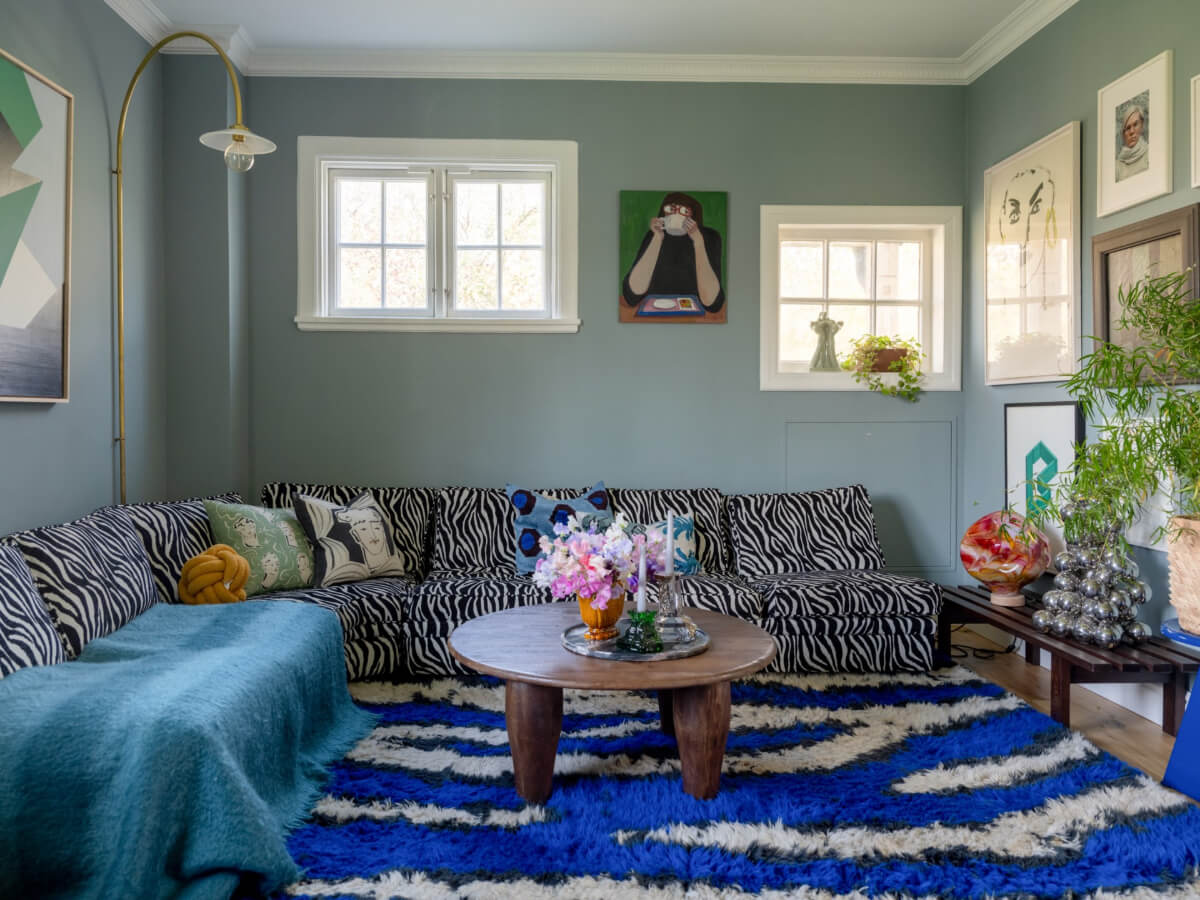 An Early 20th-Century Family Home Decorated with Color and Art 3 living room zebra sofa large cobalt blue rug