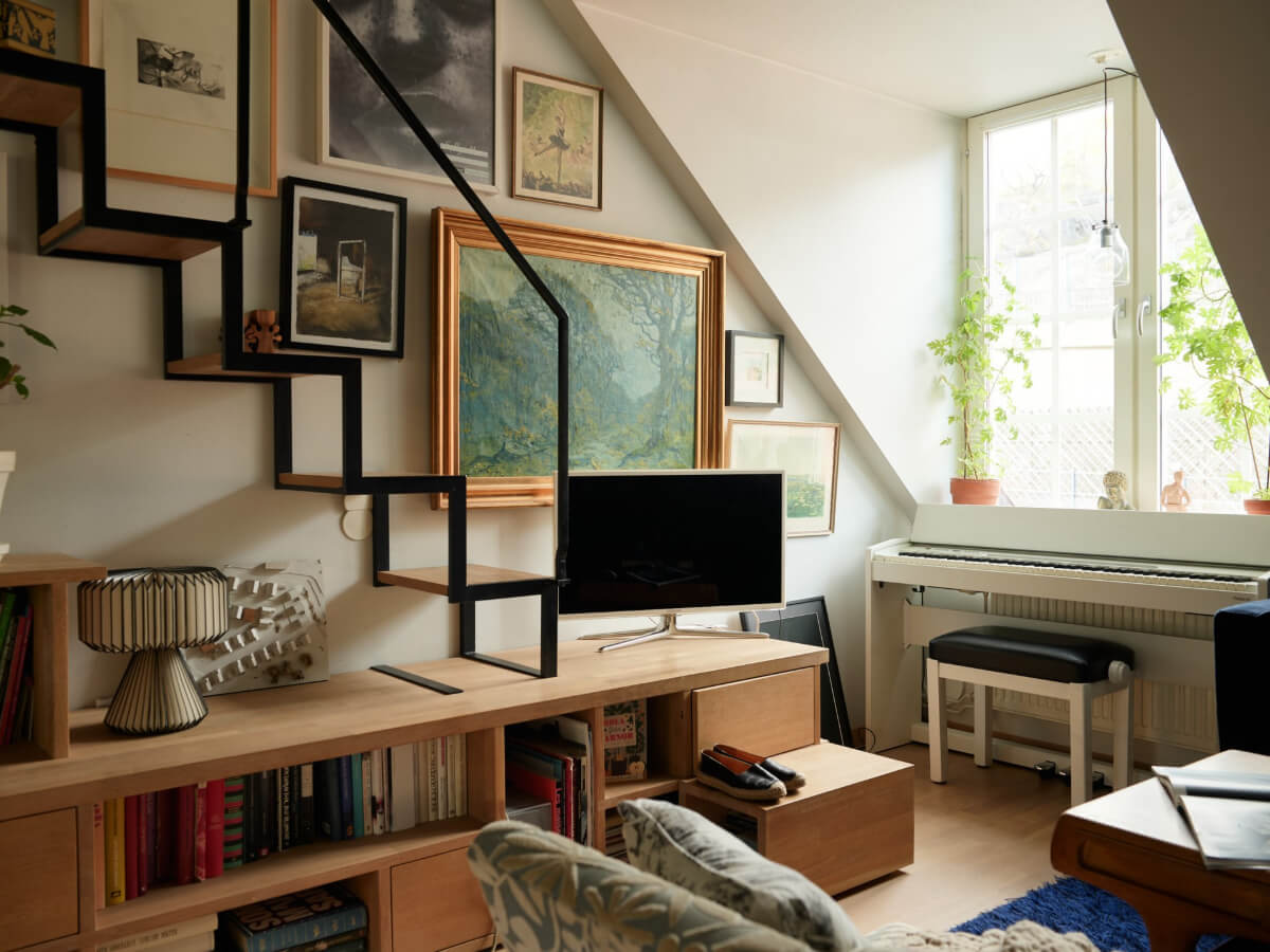 A Stunning Top-Floor Apartment with High Ceilings in a Former Church 19 loft staircase bookcase art