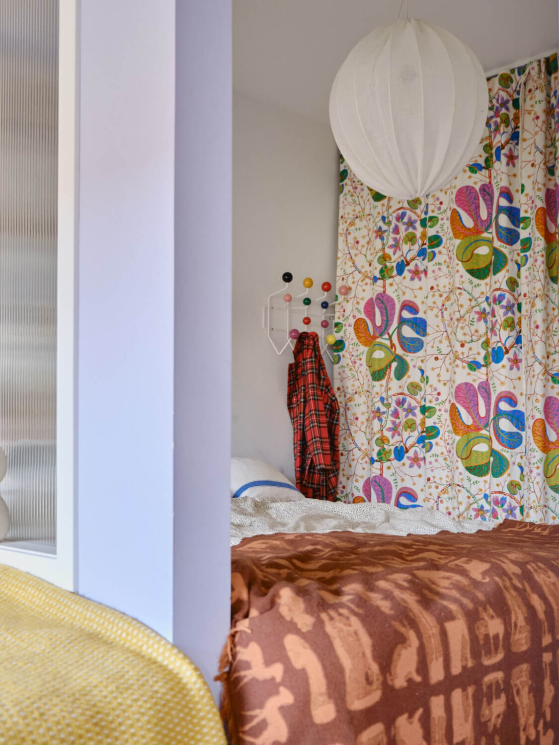 A Colorful 1940s Apartment with Original Elements 25 master bedroom colorful curtain