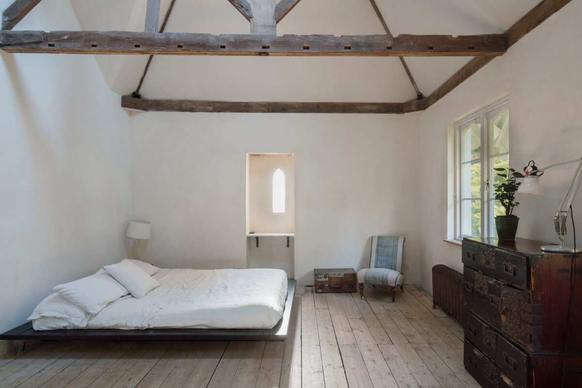 Grand, Light-Filled Spaces in a Gothic-Style English Coastal Home 14 minimalistic bedroom rustic elements