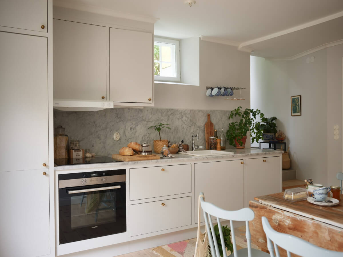 A Stylish Basement Apartment with a Private Terrace 4 modern gray kitchen marbke