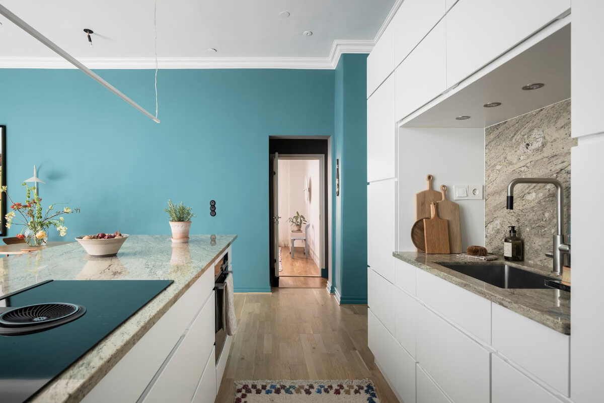 A Teal Green Living Room and Large Windows in a Swedish Apartment 15 modern white kitchen island
