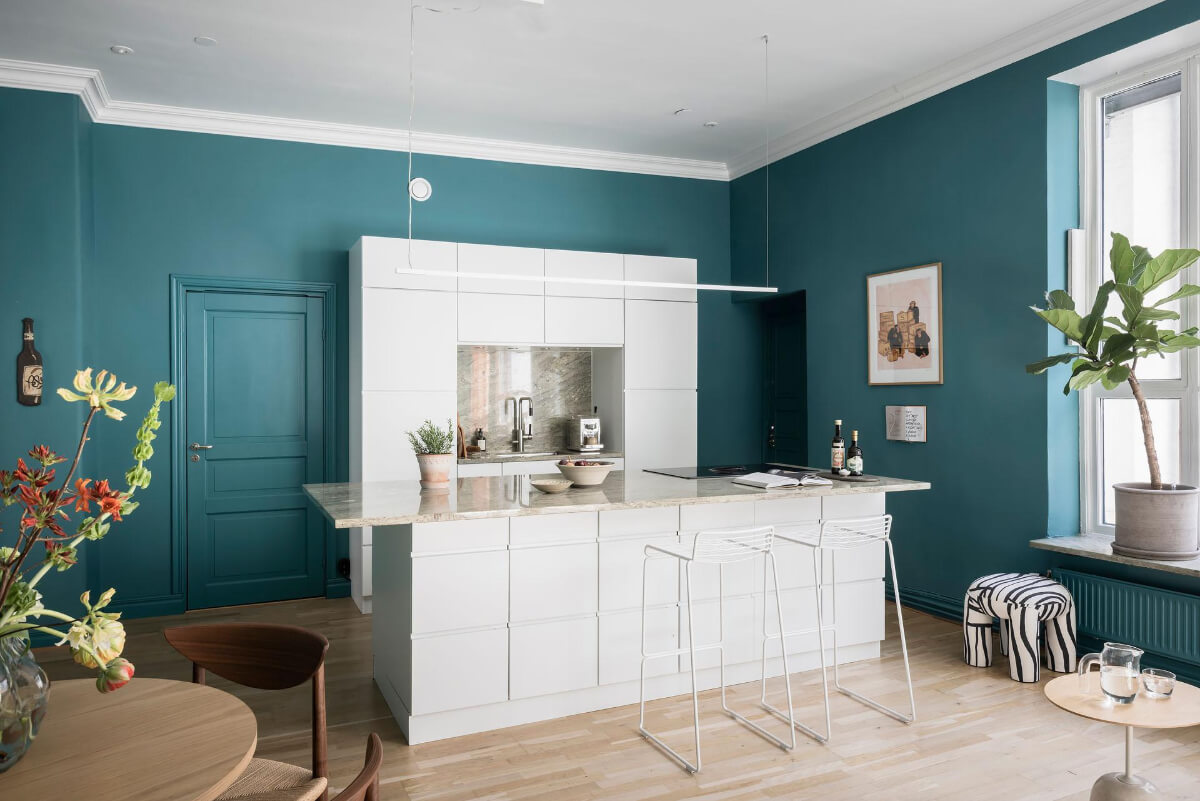 A Teal Green Living Room and Large Windows in a Swedish Apartment 11 modern white kitchen with island
