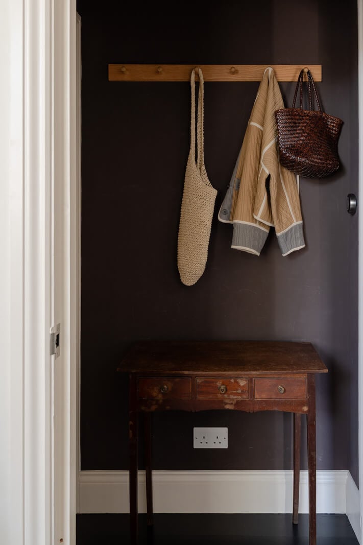 Contemporary and Classic Design in a Two-Bedroom London Duplex 21 moody dark gray hall