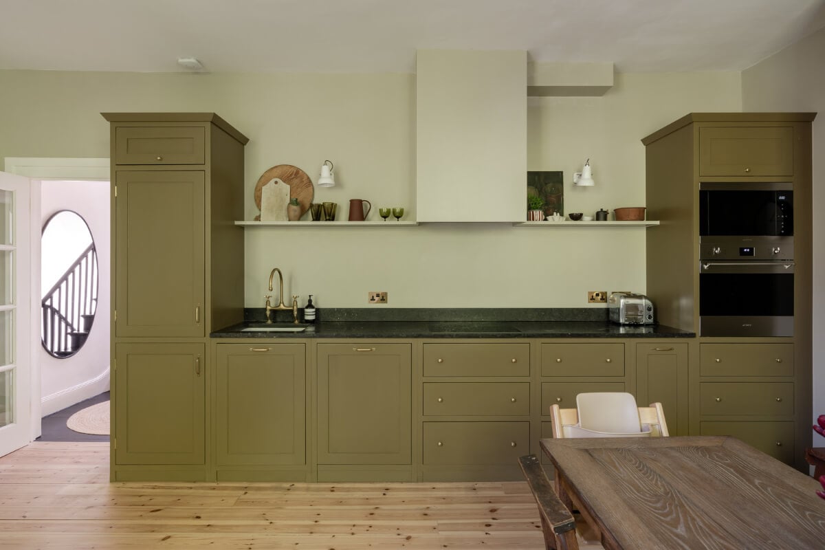Contemporary and Classic Design in a Two-Bedroom London Duplex 6 olive green kitchen belgian limestone countertop