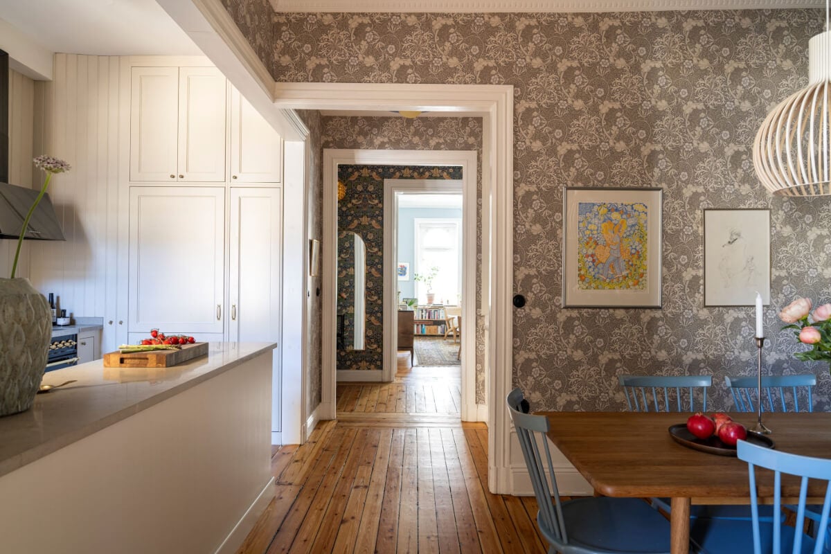 Wallpapers and Blue Tones in a Cozy Turn-of-the-Century Home 22 open layout floral wallpaper dining area