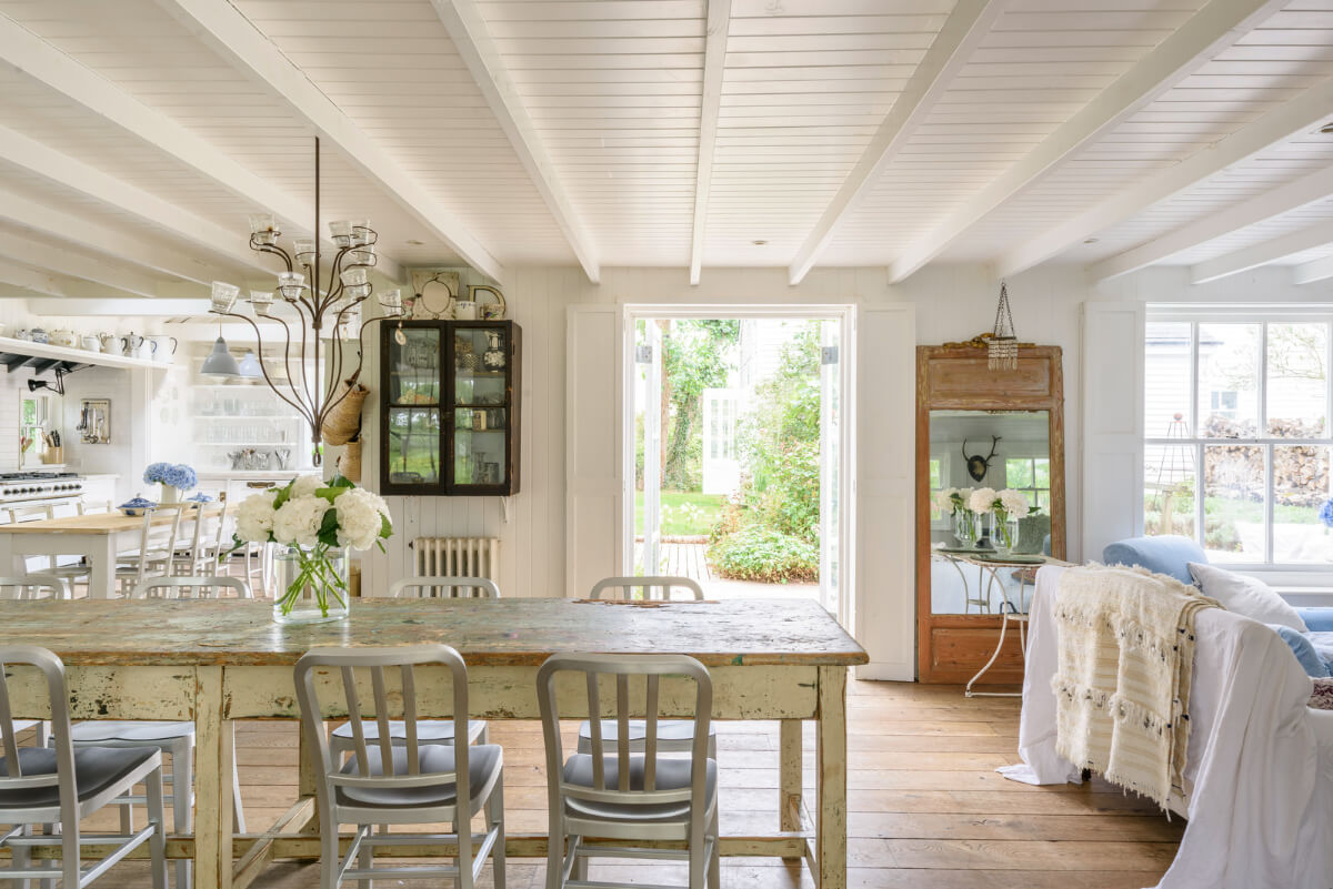 A Bright New England-Style Home with a Lush Garden 3 open-plan coastal style living room wooden ceiling