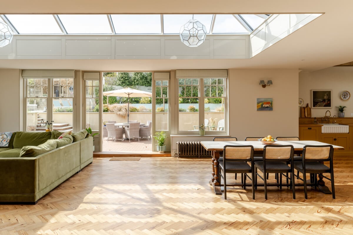 A Grand Edwardian Villa with a Yellow Kitchen and Coastal Views 9 open plan kitchen living space skylight garden access